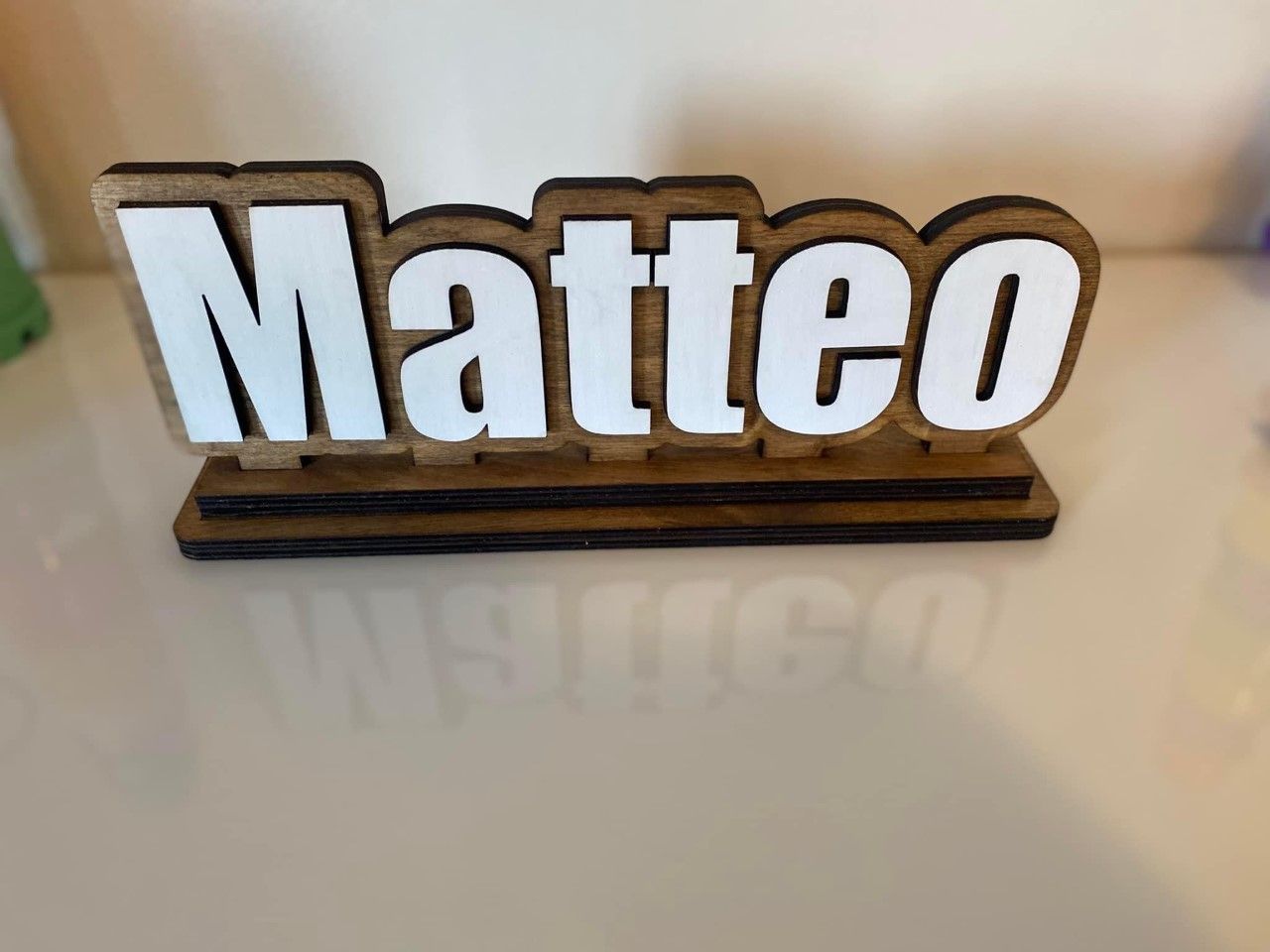 A wooden sign with the name matteo on it