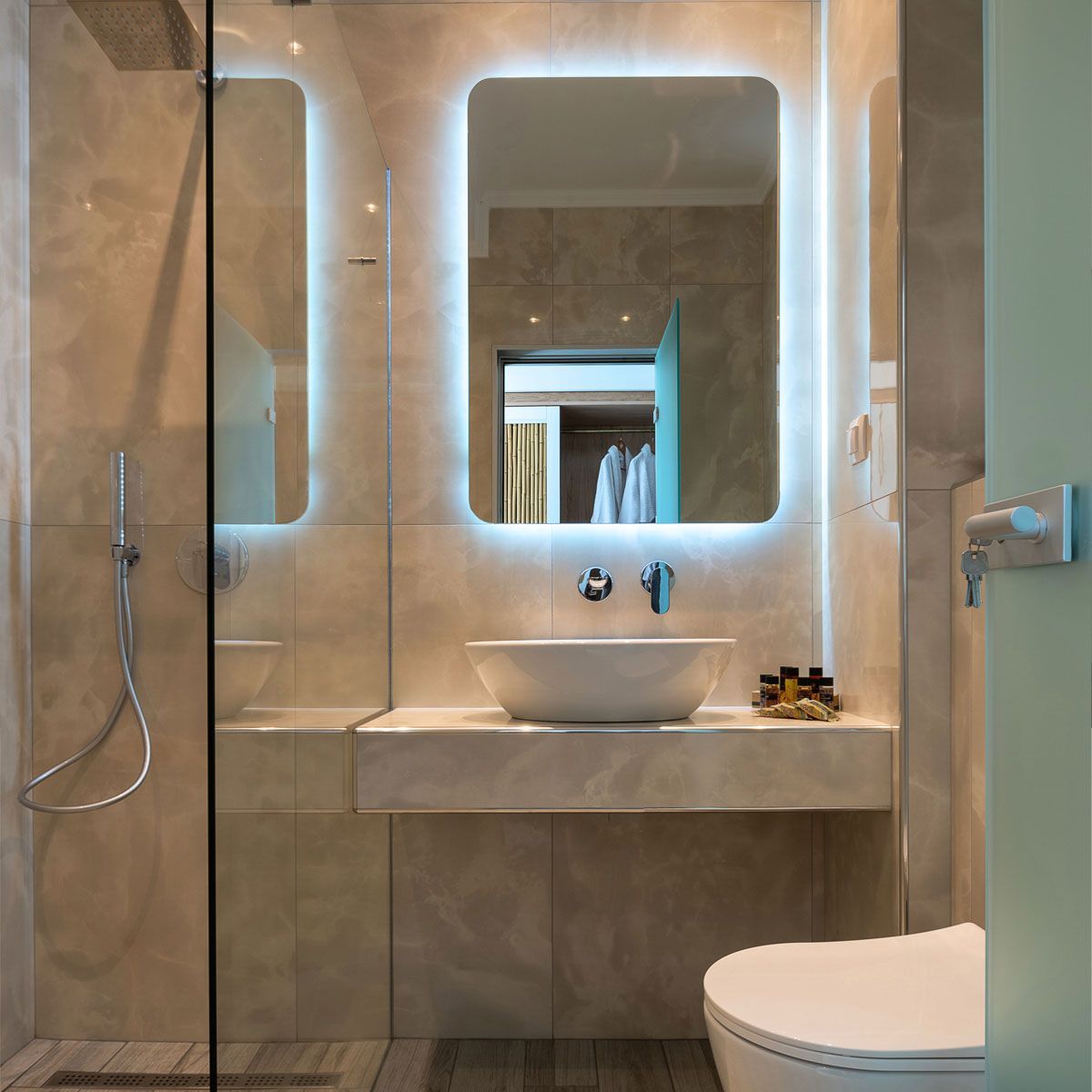 Backlit mirrors in modern designed bathroom