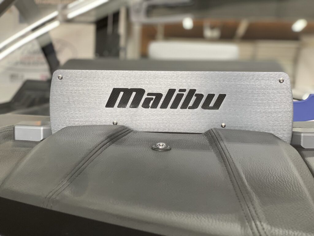 A malibu logo is on the side of a boat.