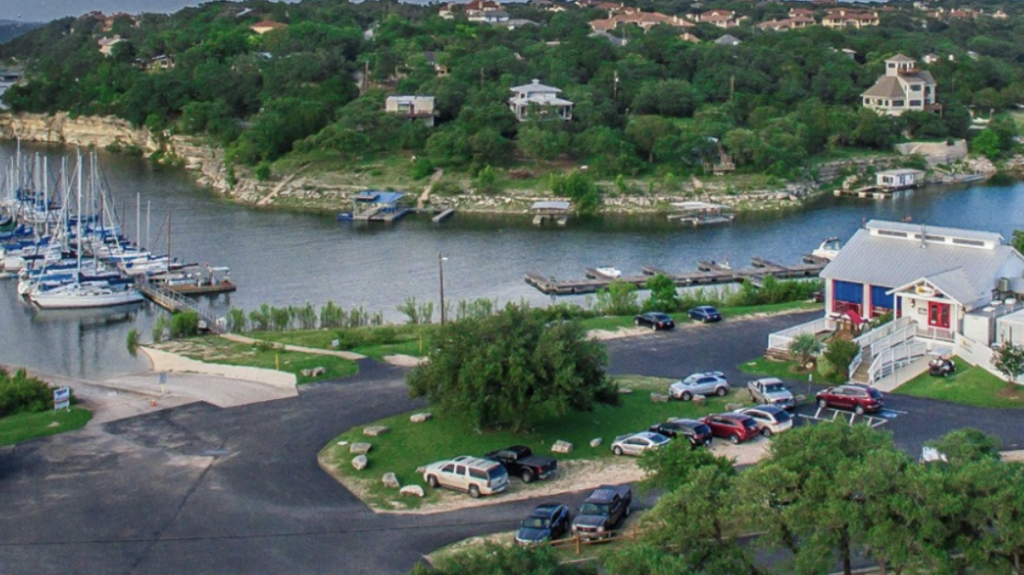 An aerial view of a marina with boats docked in the water