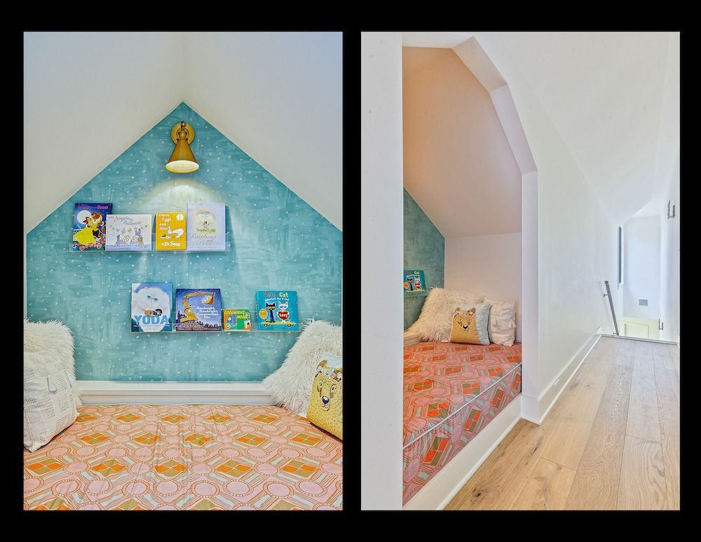 A cozy reading nook built into a slanted alcove, featuring a turquoise wall, bookshelf, and a cushioned sleeping area.