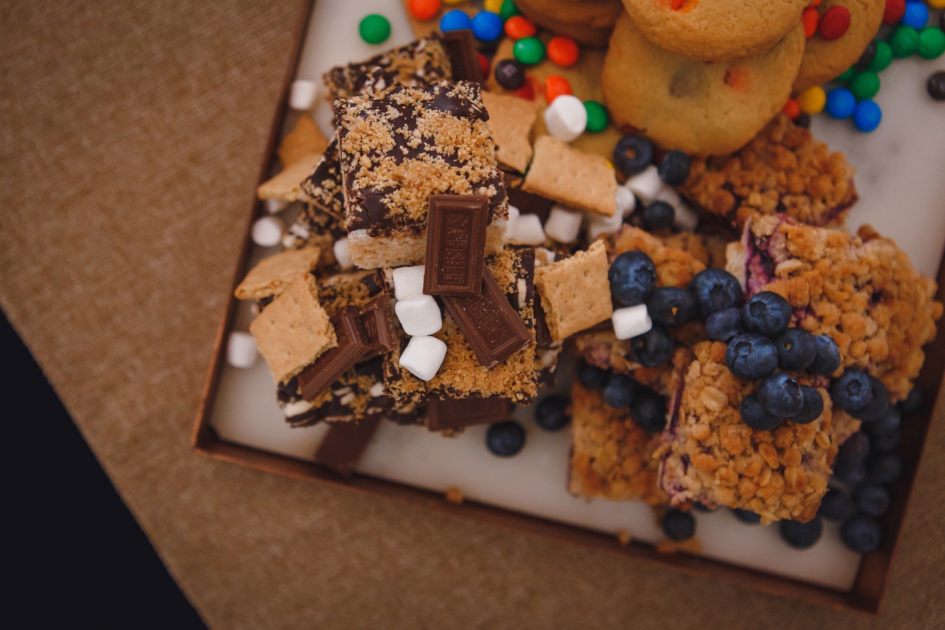 A box filled with lots of different types of desserts.