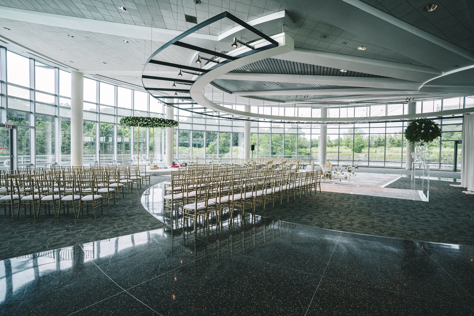 A large building is reflected in the water at night.