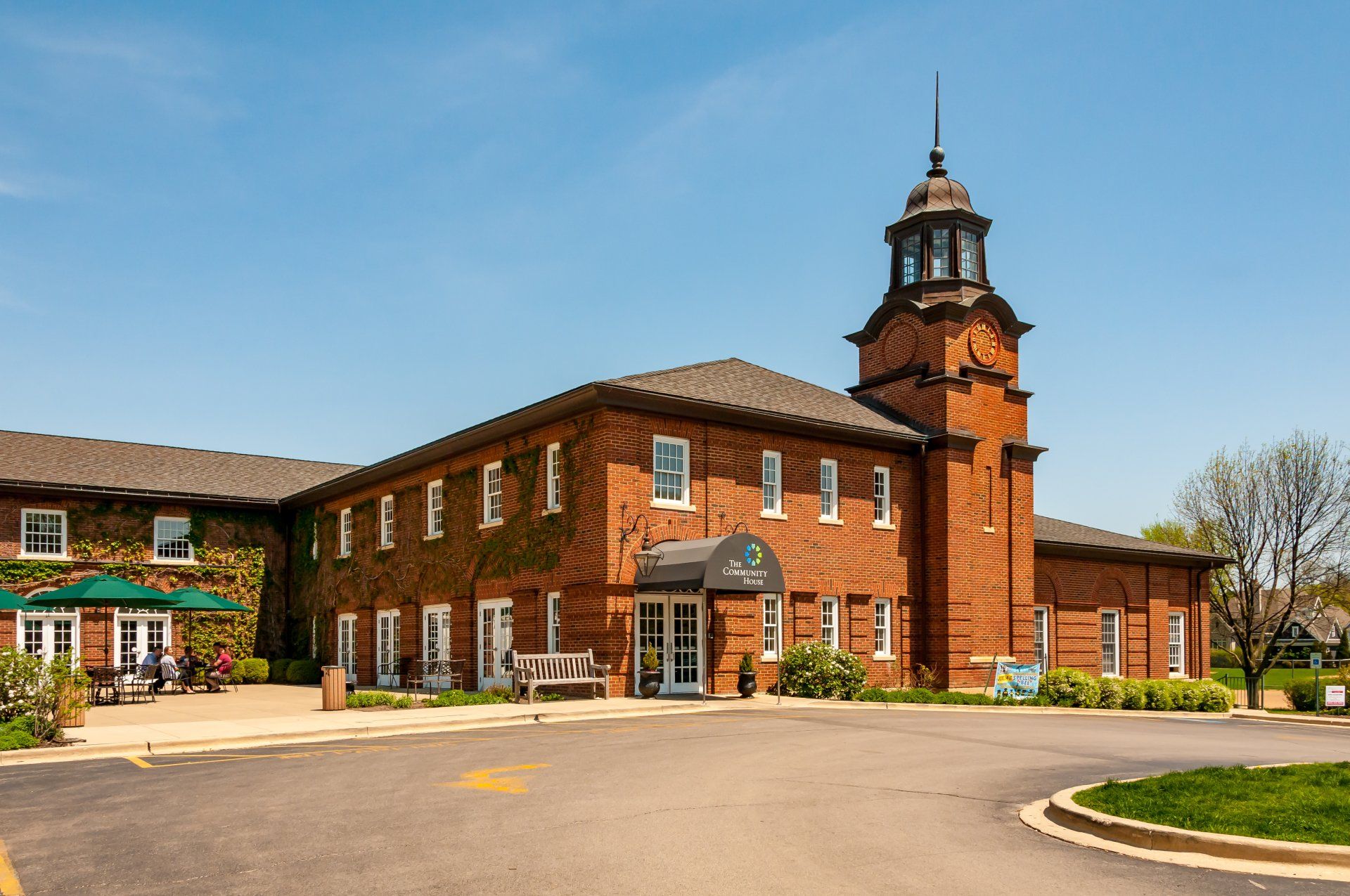 A large brick building with a clock tower on top of it.