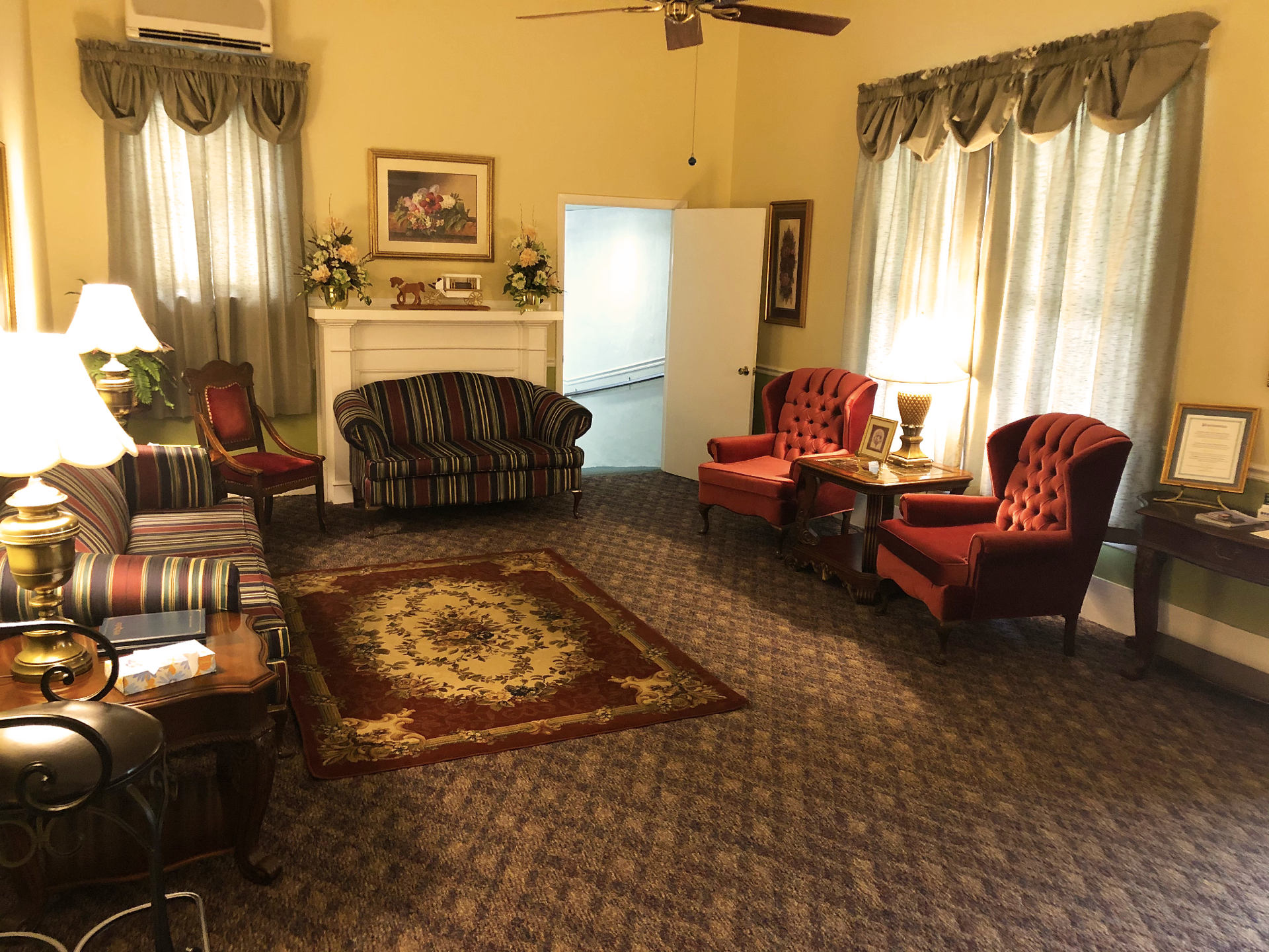 A living room filled with furniture and a fireplace