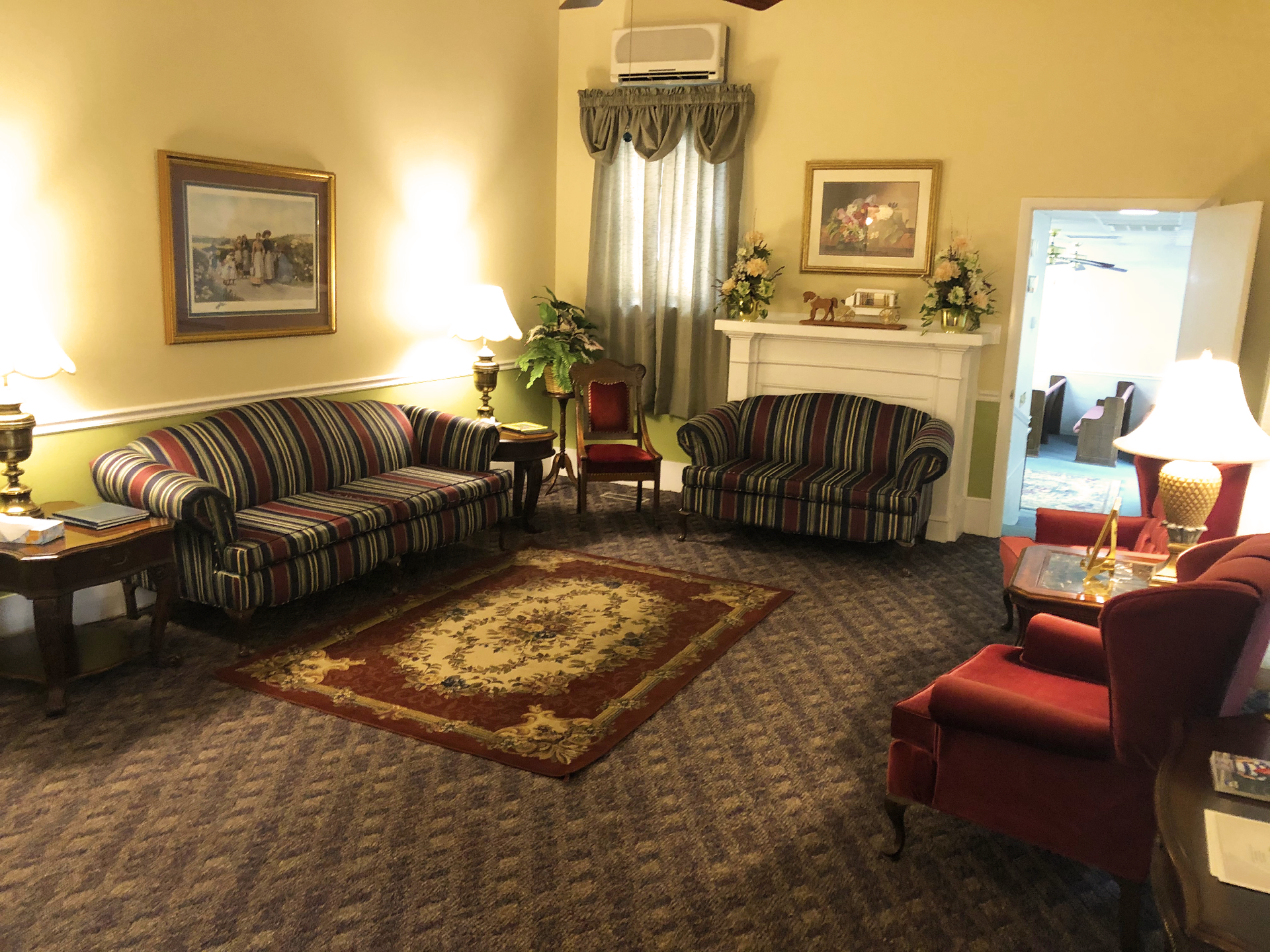 A living room filled with furniture and a fireplace.