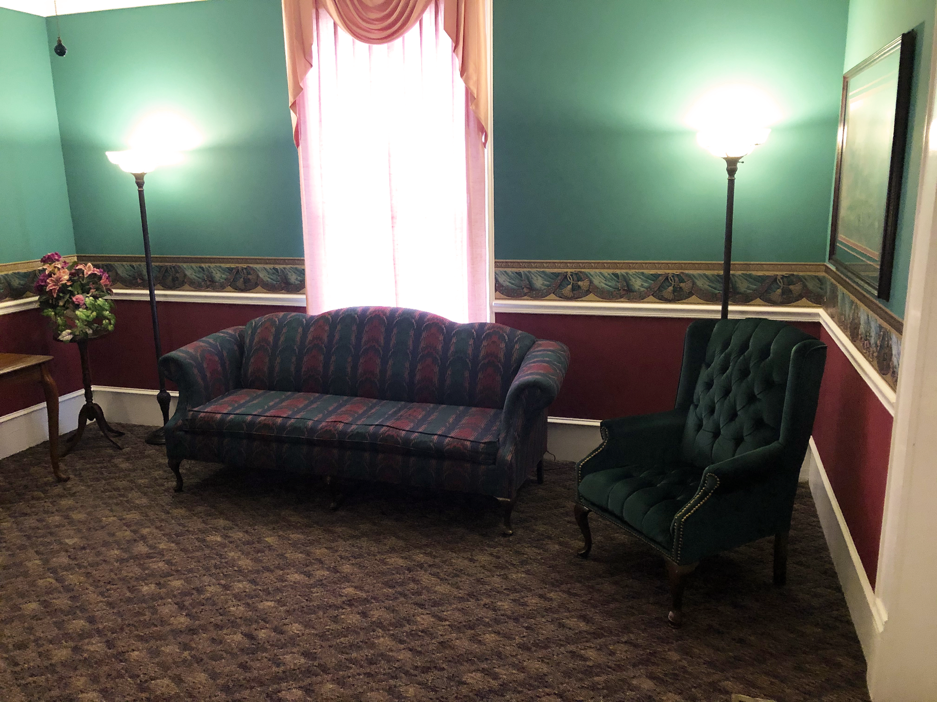 There is a couch and a chair in the room.