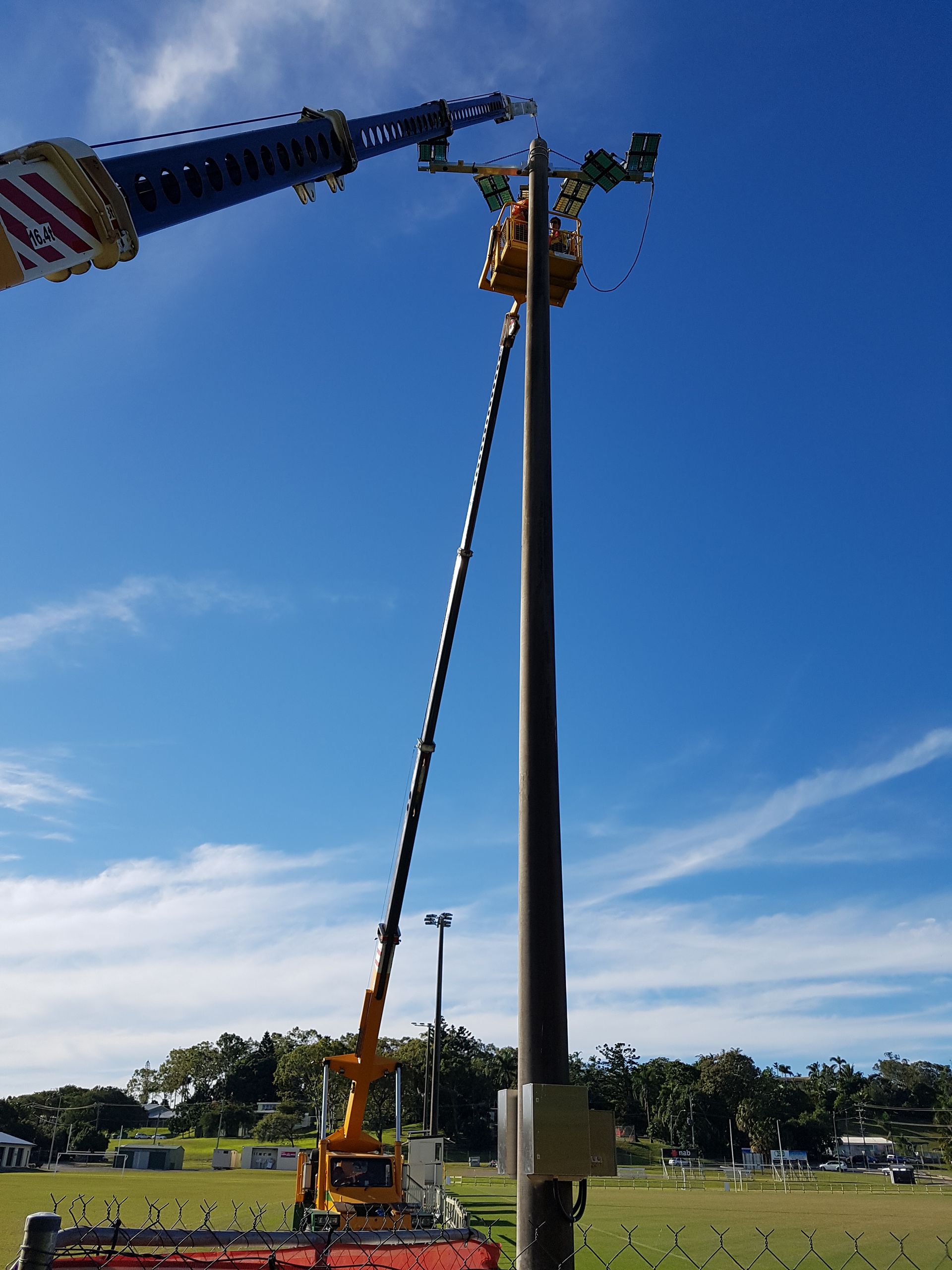 Yellow Mobile Crane at a Construction Site, Lifting, With Concrete Pillars — Statewide Lift & Shift Pty Ltd In Sarina, QLD