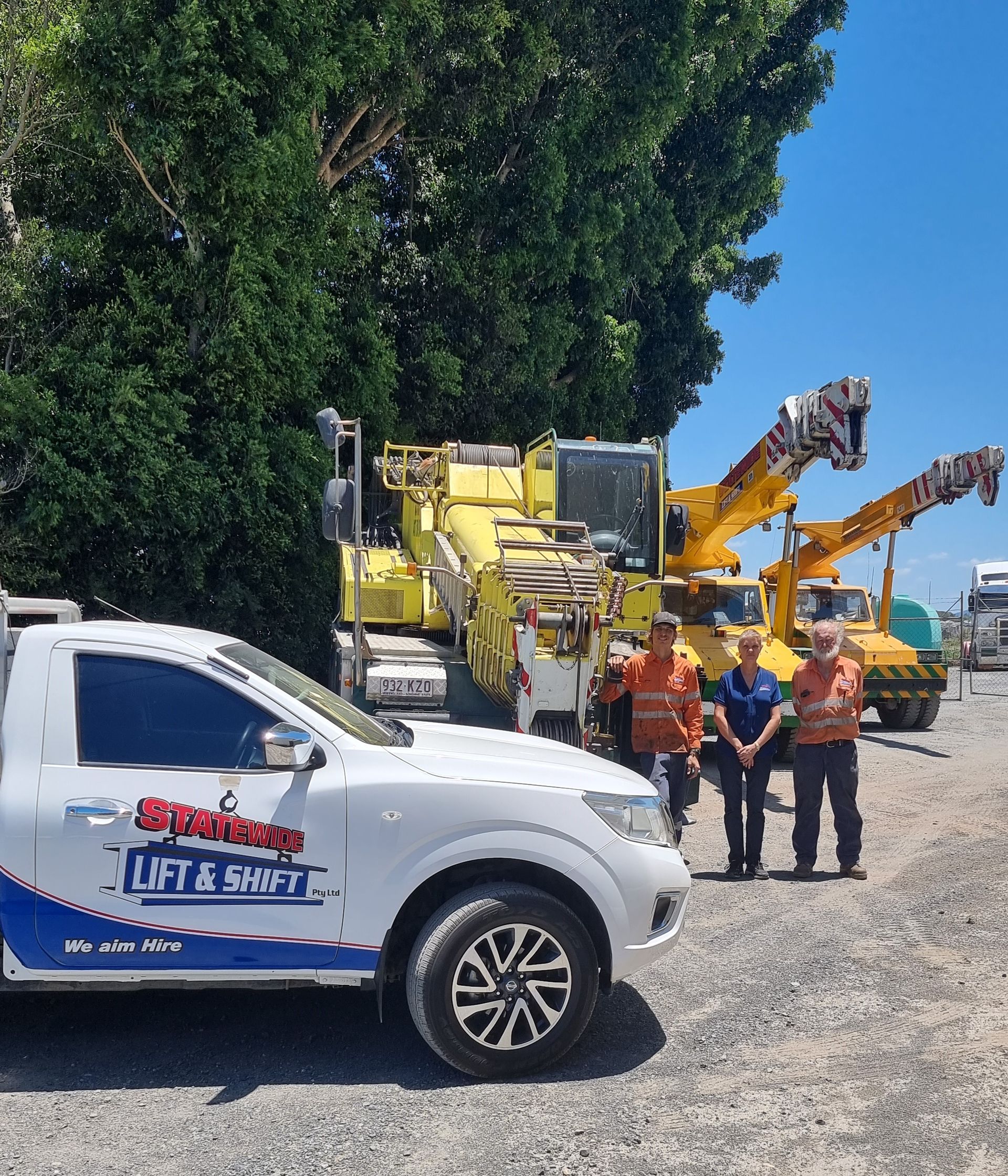 Yellow And Black Crane Lifting Scrap Metal at a Recycling Yard Under — Statewide Lift & Shift Pty Ltd In Sarina, QLD