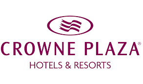 The logo for Crowne Plaza Hotels & Resorts, featuring a stylized purple ribbon graphic above the brand name in purple text.