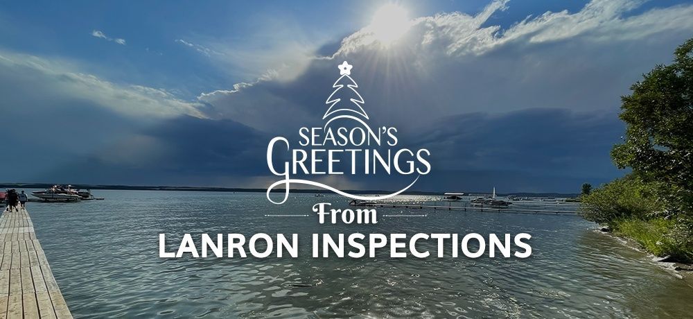 A sign that says season's greetings from lanron inspections.