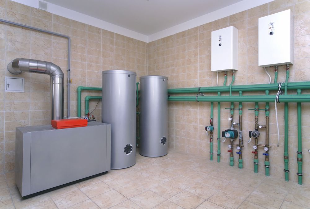 Utility Room With Two Water Heaters, a Furnace — White Rose Electrical in Coffs Harbour, NSW