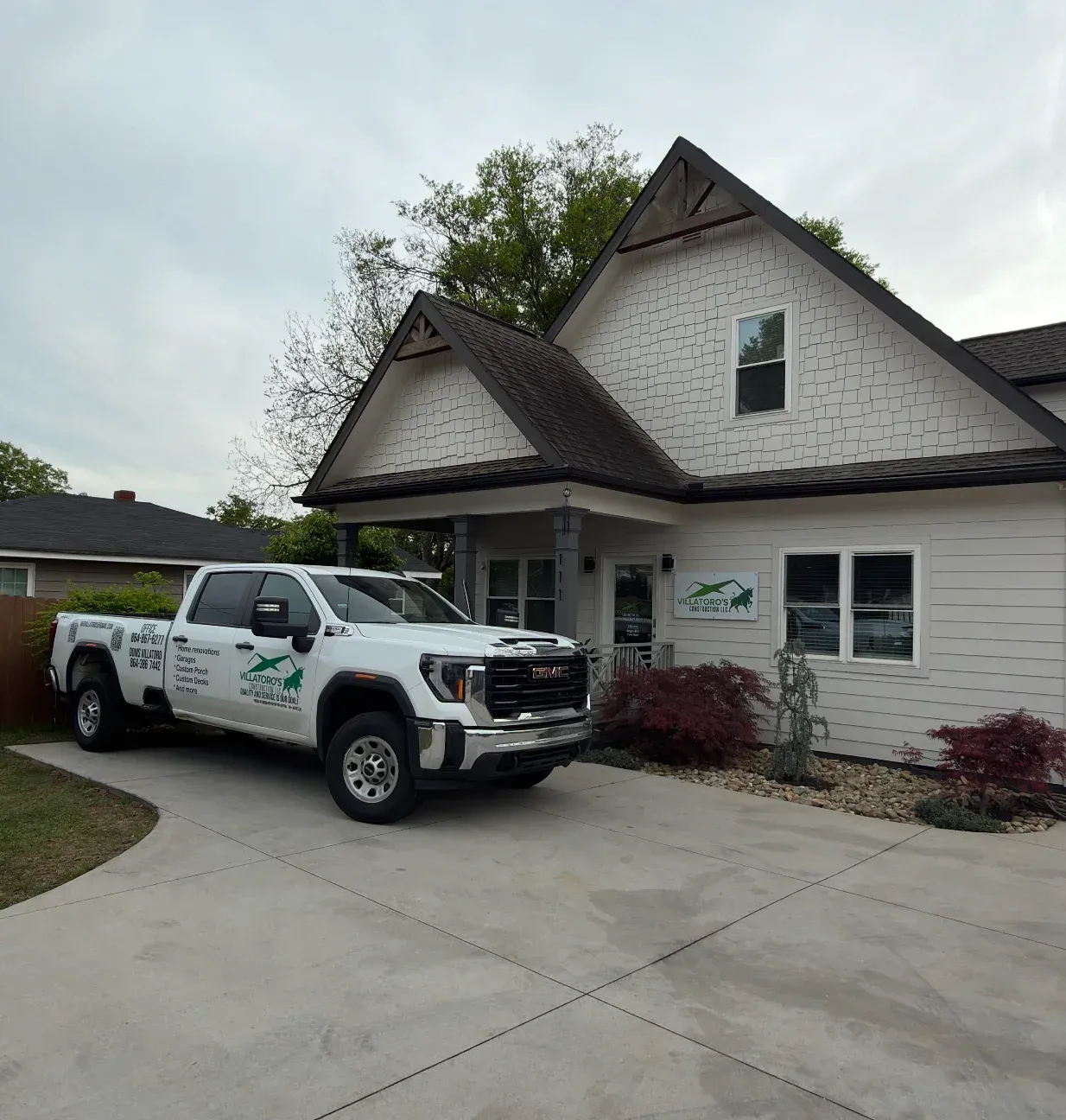 Outdoor deck with pergola, seating area, and scenic view. Brown deck, furniture, and pergola.