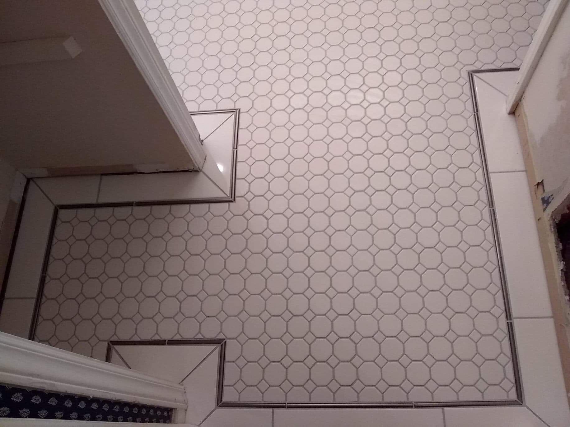 A white tile floor with circles on it