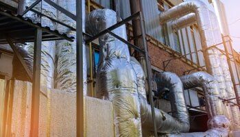 Wall of industrial building with pipes - Mechanical insulation in North Charleston, SC Wall of industrial building with pipes - Mechanical insulation in North Charleston, SC