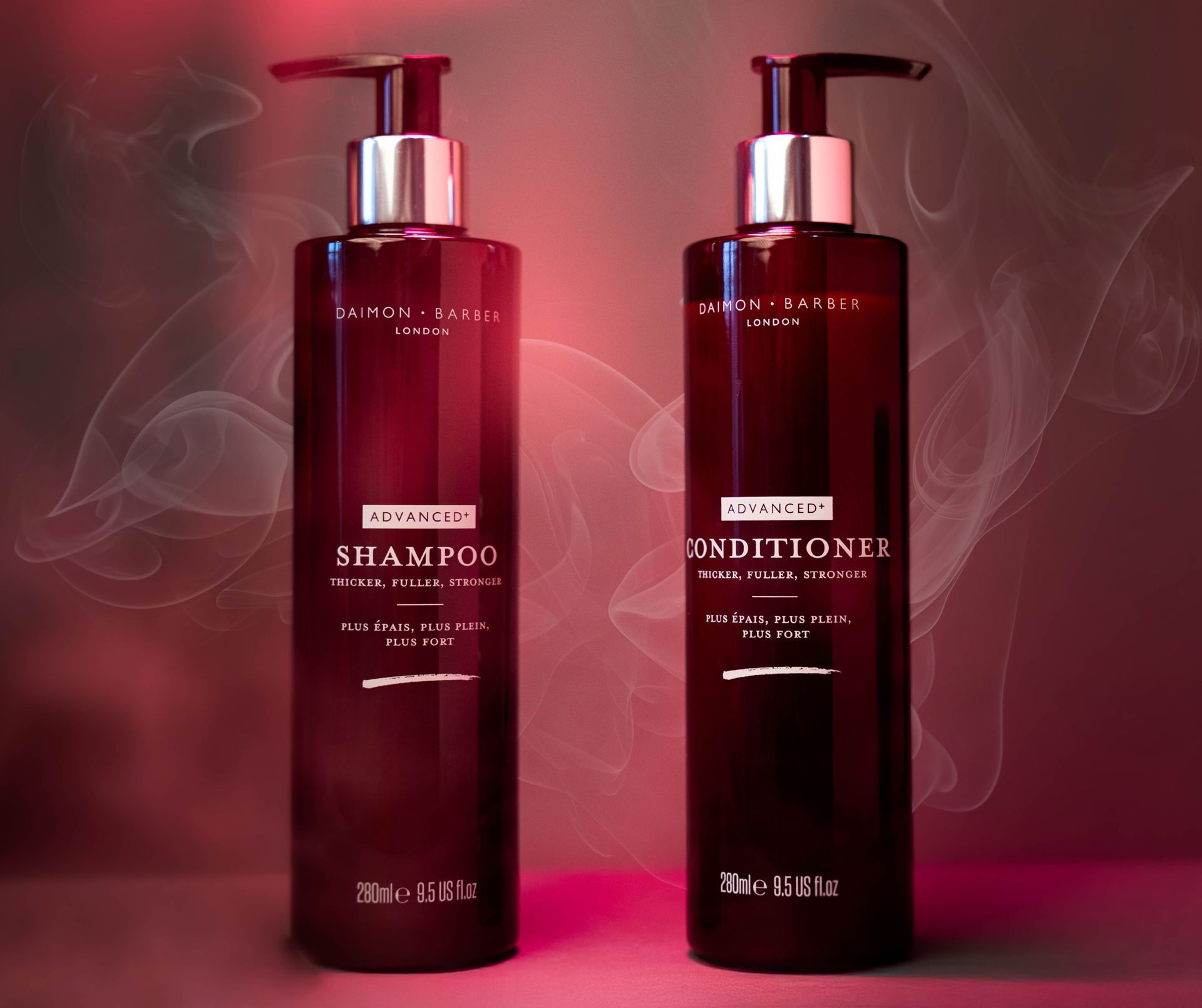 Two bottles of shampoo and conditioner are sitting next to each other