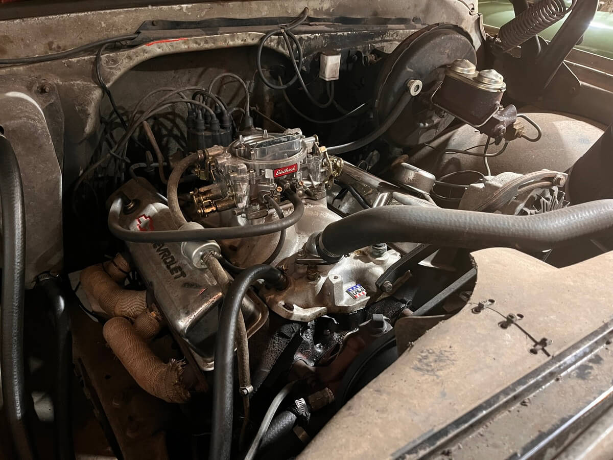 A close up of a chevrolet engine in a car