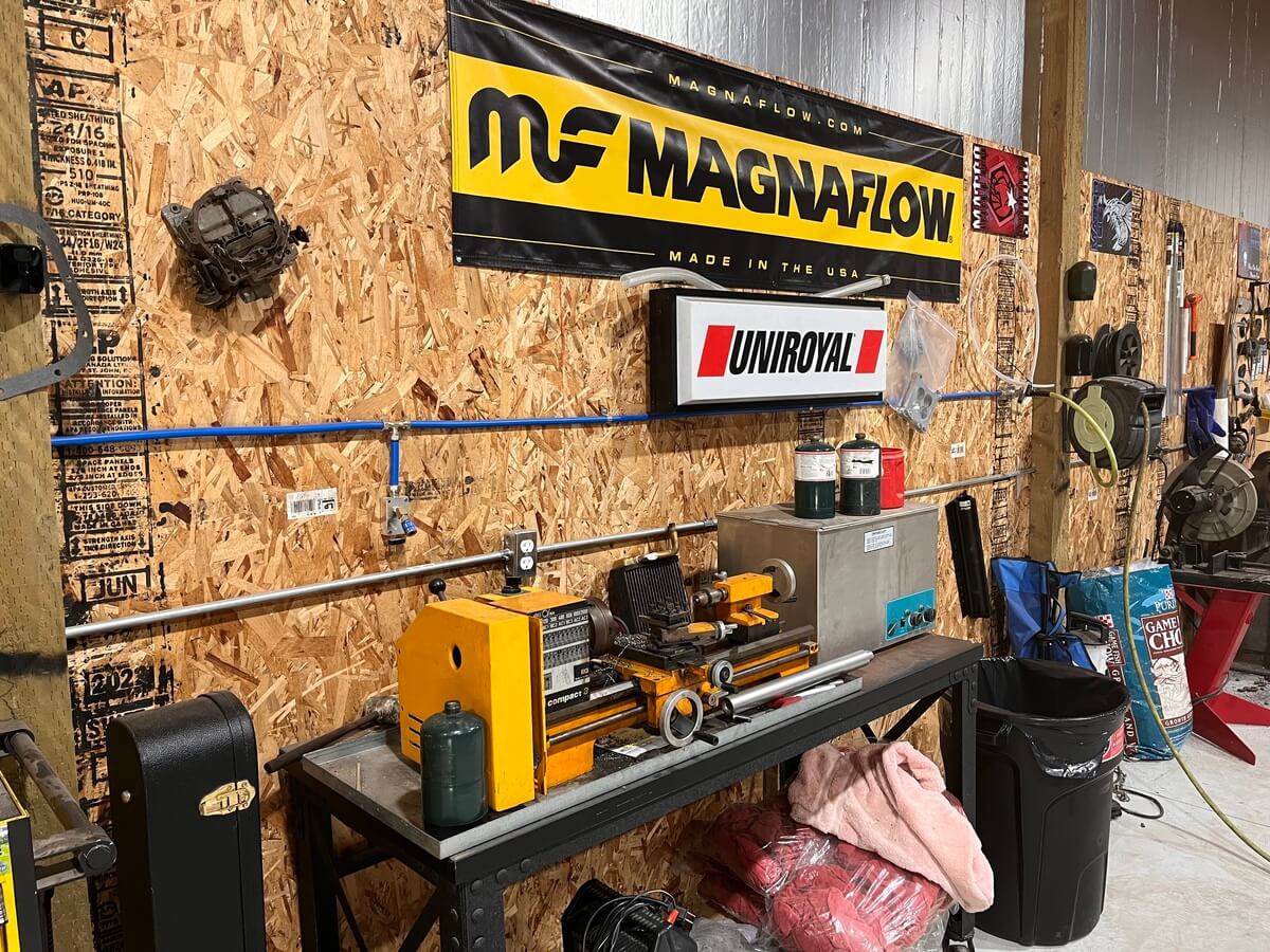 There is a sign on the wall that says magnaflow.