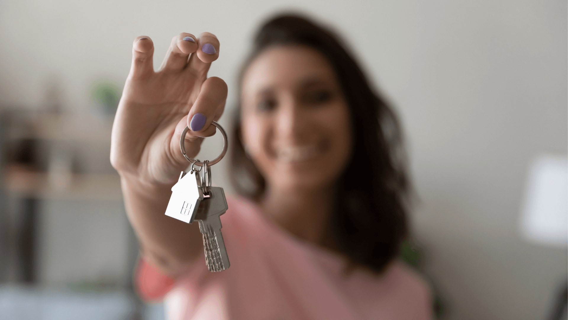 Property manager handing keys to tenant