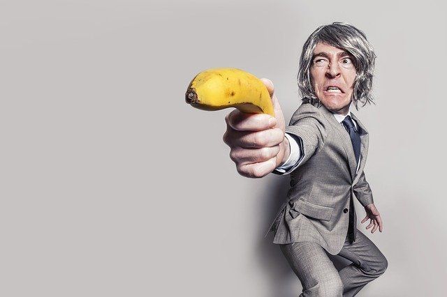 Angry man with a banana gun