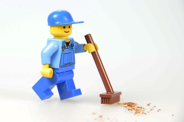 lego man with broom