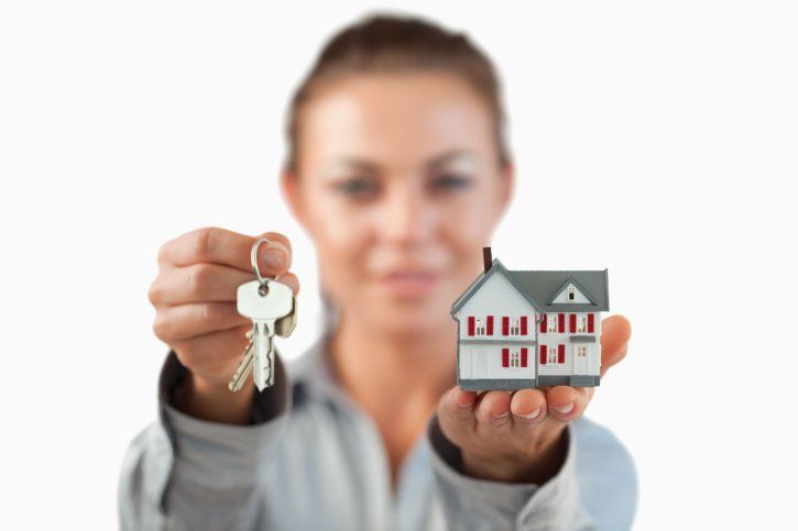 woman with keys and house