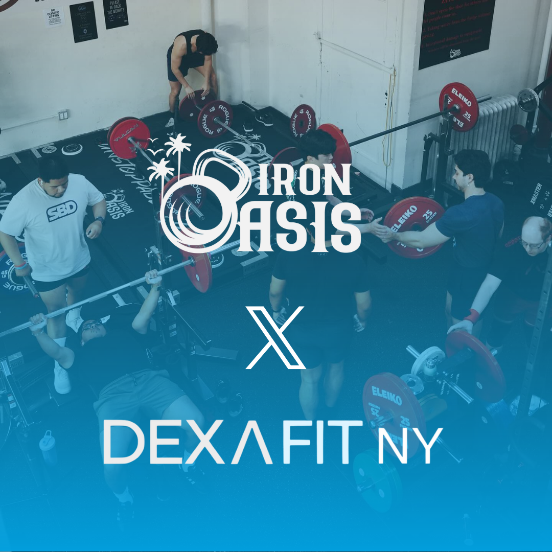 People lifting weights in a gym; Iron Oasis X DexaFit NY logo. Red weights and blue floor.