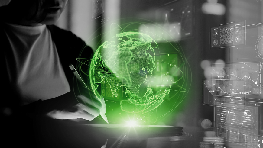 Person using a stylus with a glowing green digital earth globe overlay.