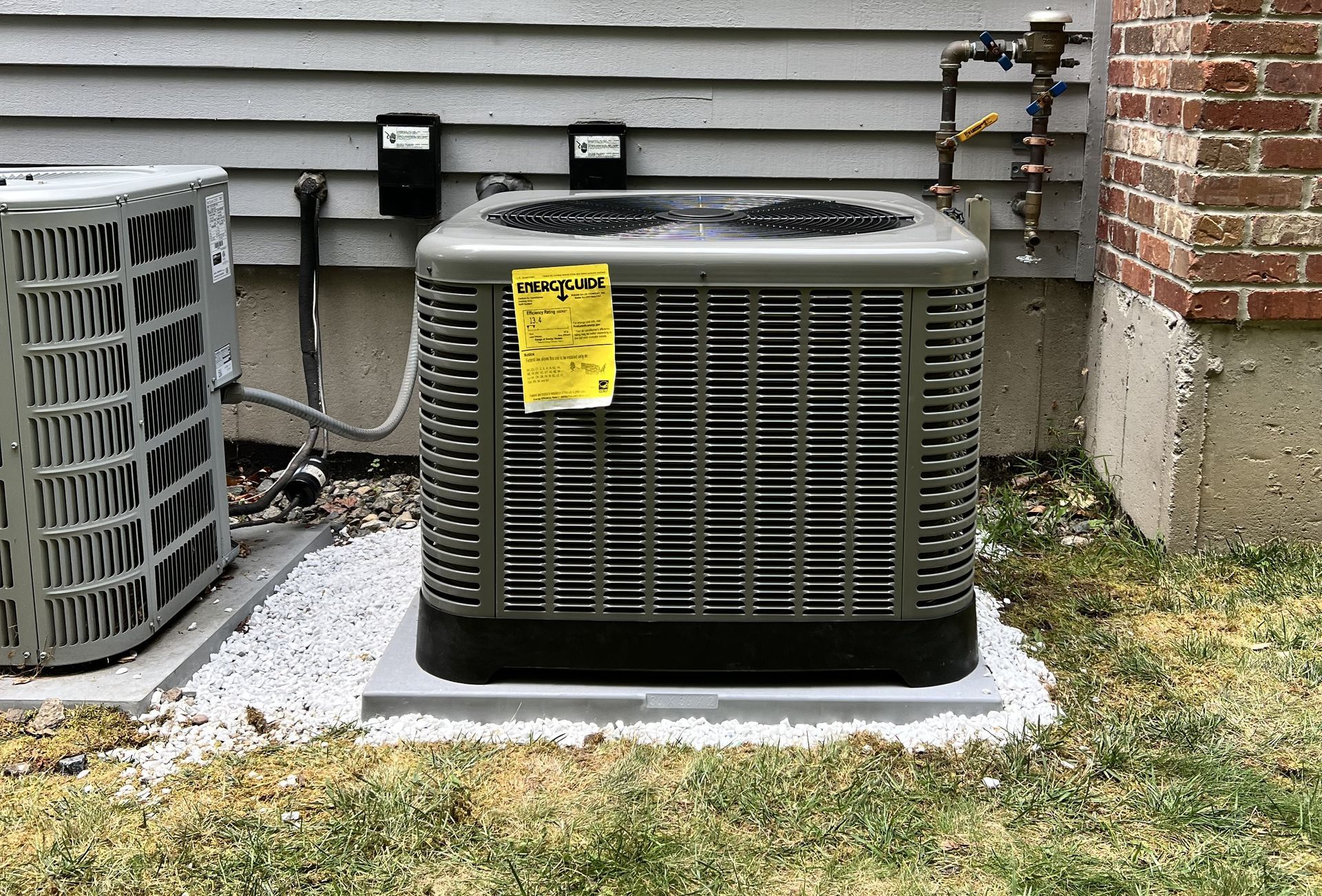 Central air conditioning units outside a house.