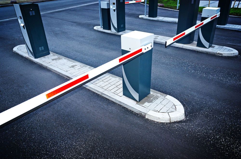 A Row Of Parking Barriers In A Parking Lot — Skilled Transport Training And Assessment in Woongarrah, NSW