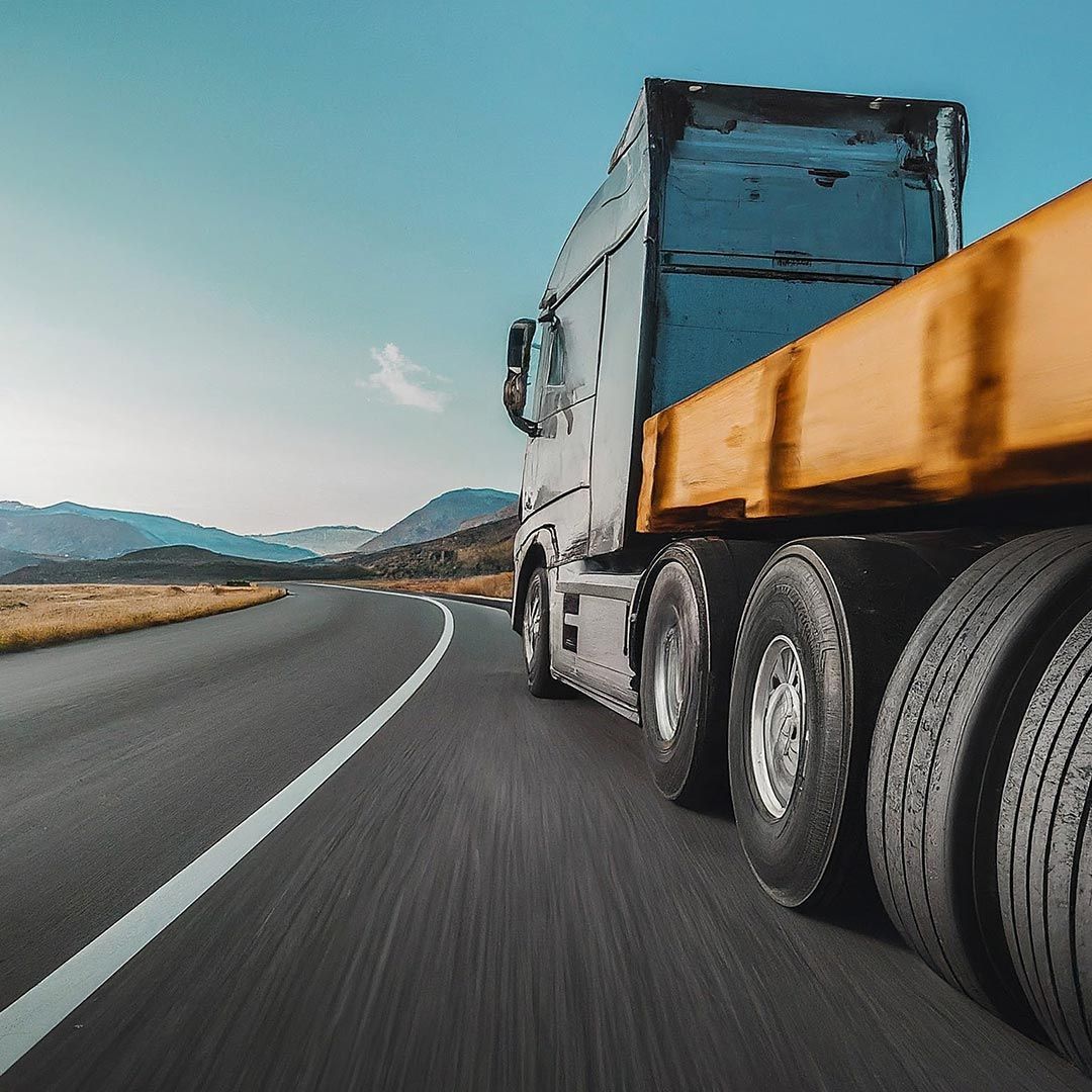 A Semi Truck Is Driving Down a Highway — Skilled Transport Training And Assessment in Woongarrah, NSW