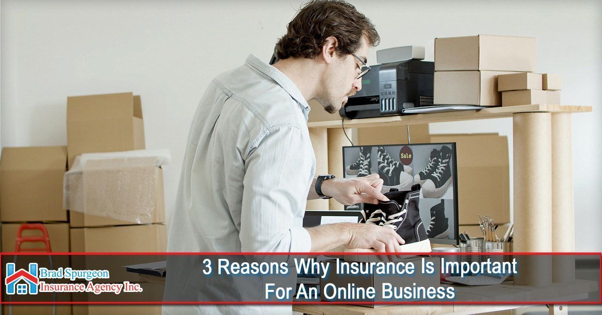 A person working at a desk with shipping boxes and a computer