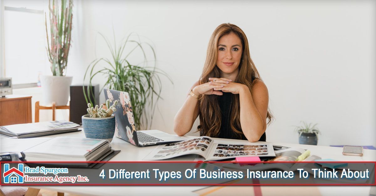 A person sitting at a desk with a laptop and an open book