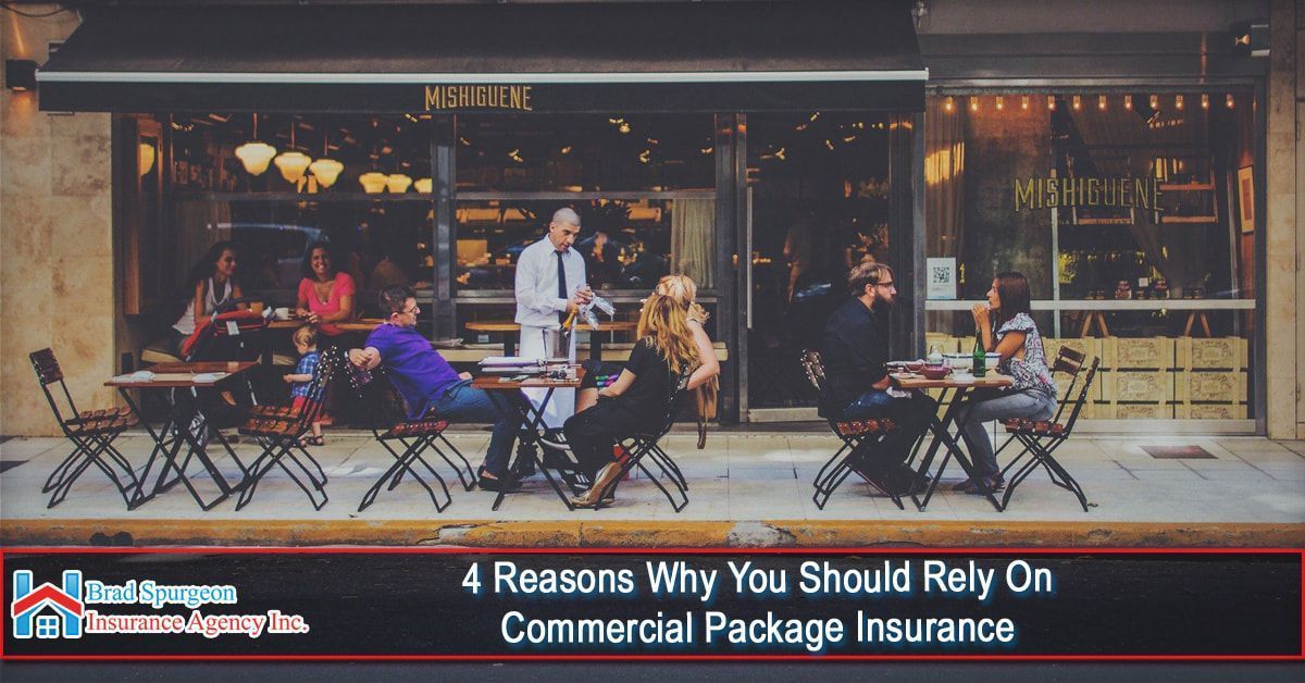 Patrons dine at tables on a sidewalk outside a restaurant