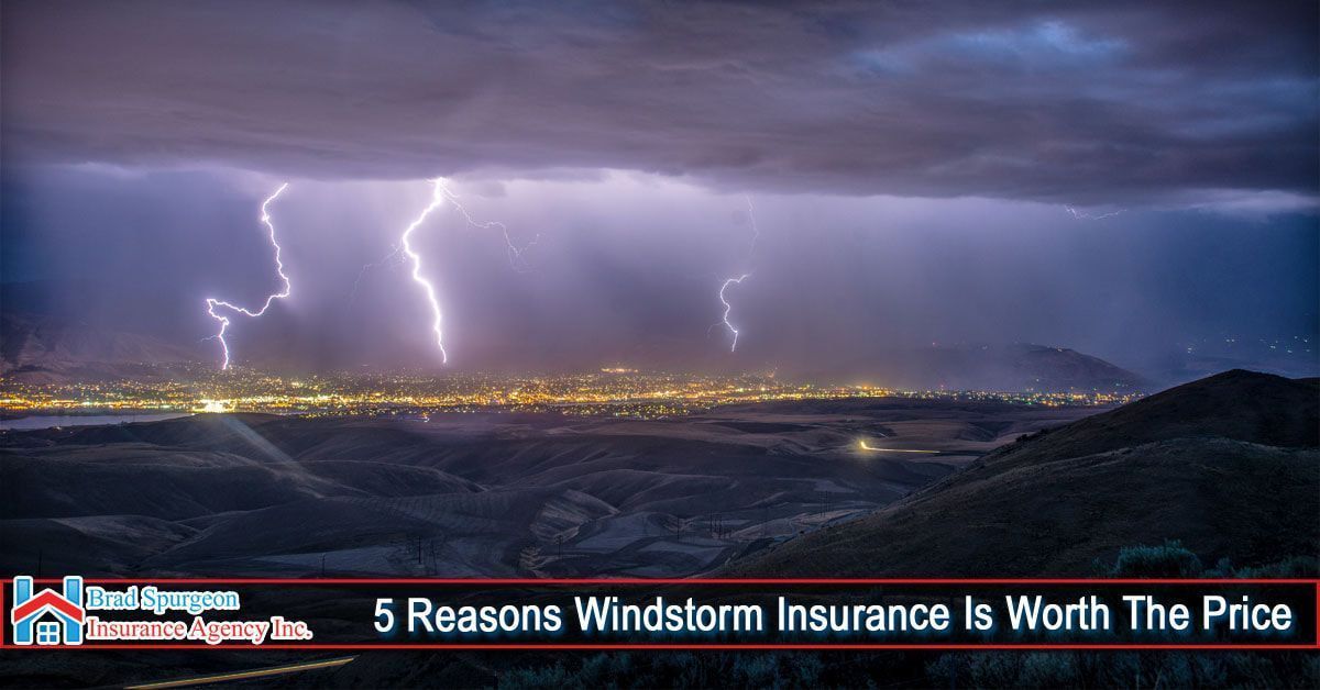 Lightning flashes over a city skyline at night 