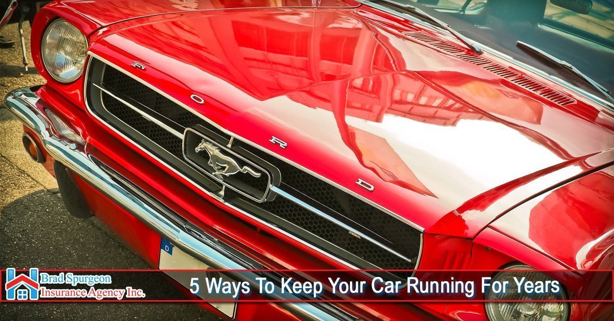 The front of a classic red Ford Mustang 
