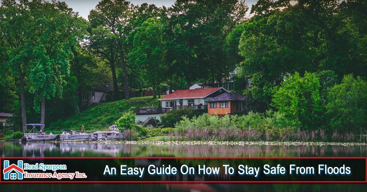 A house sits on a hill overlooking a lake