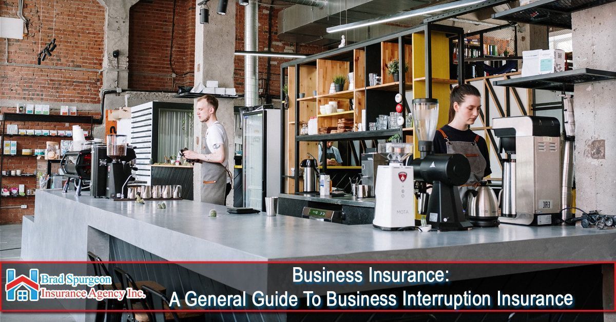 Two employees work behind a modern concrete coffee shop counter.