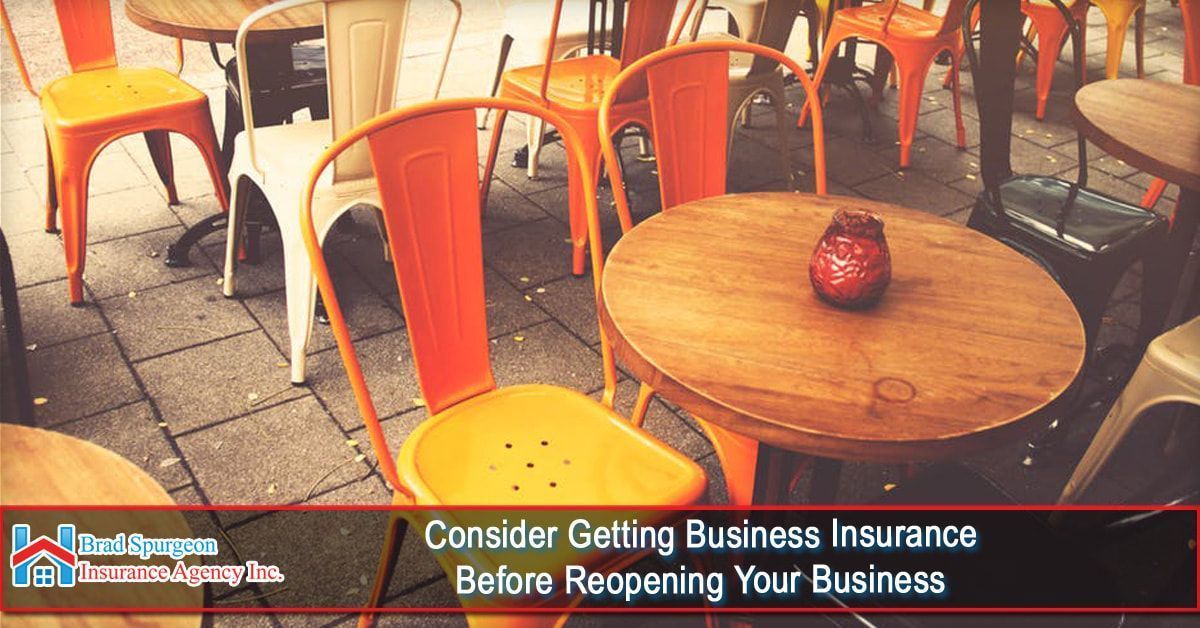 An outdoor cafe setting with orange chairs and wooden tables