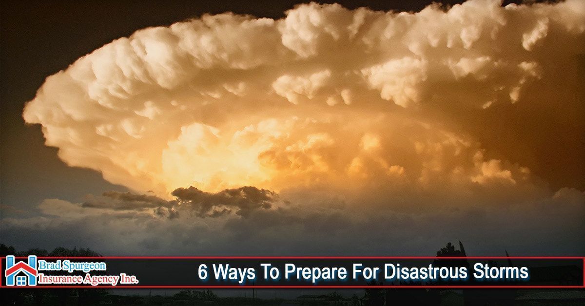 A golden, dramatic thunderstorm cloud looms over a dark horizon 