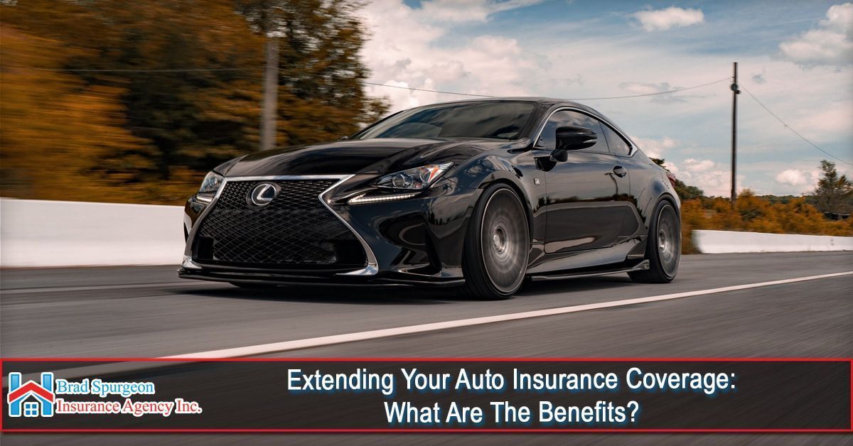 A black Lexus sports car driving on a road