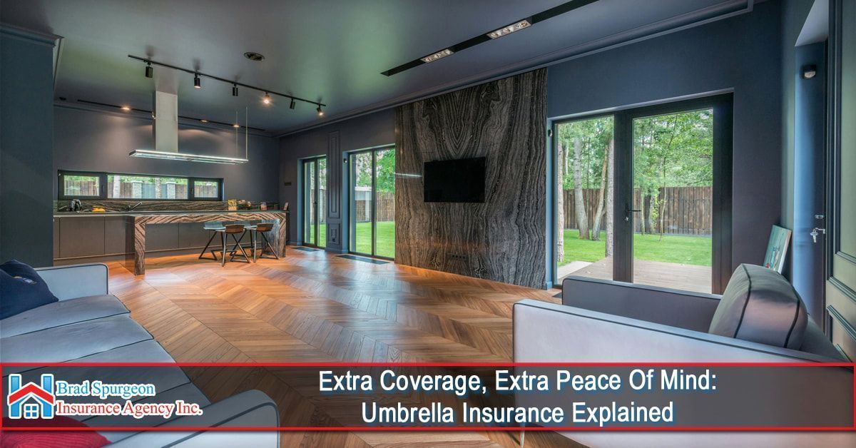 A modern living room with a large stone accent wall and herringbone floors