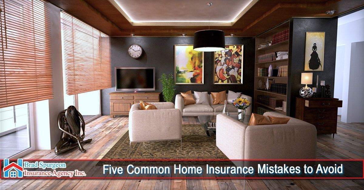 Modern living room with beige sofas, wood floors, and a dark accent wall