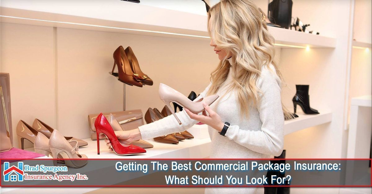 A person shops for high heels in a bright, modern retail store