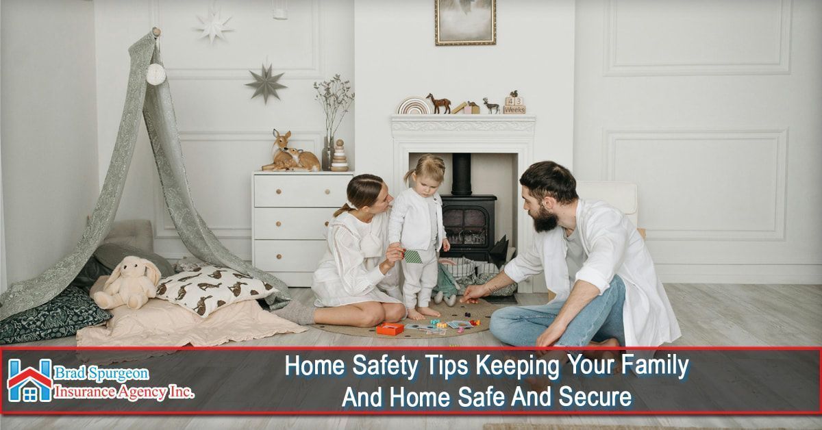 A family sits on a living room floor near a fireplace and play tent
