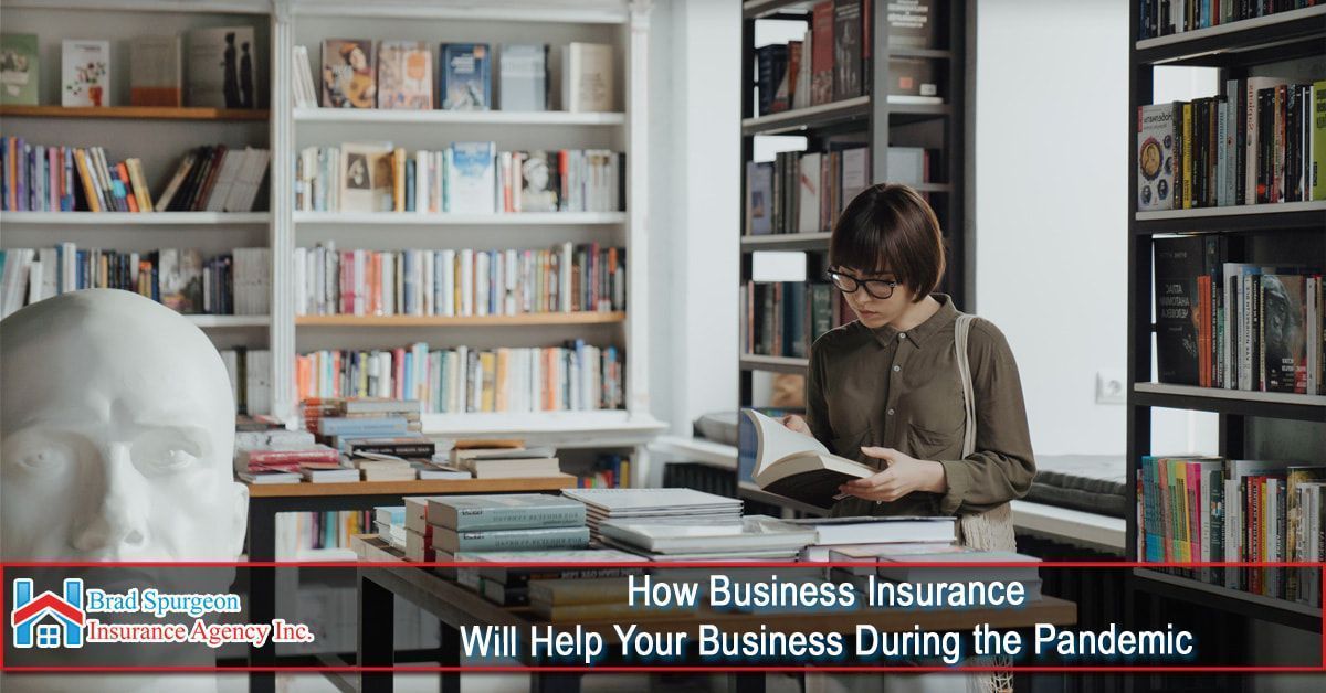 A person reads a book in a library