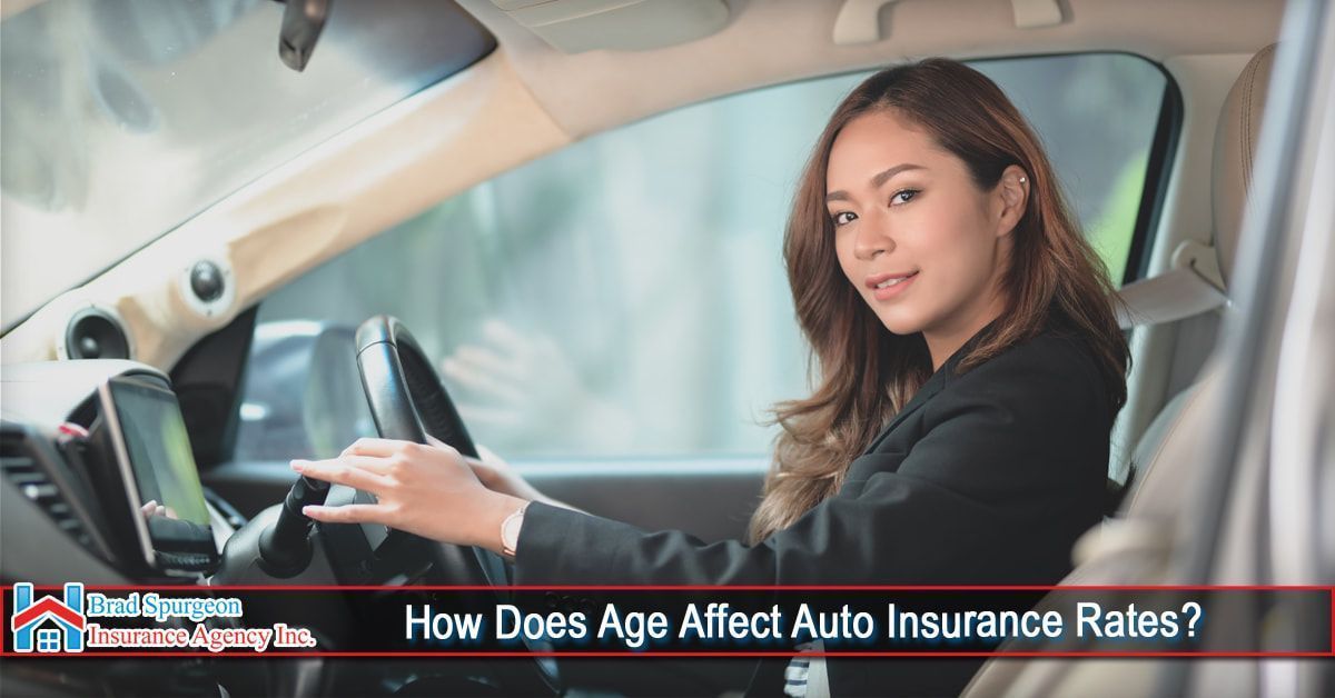 A person in a dark blazer sitting in a car