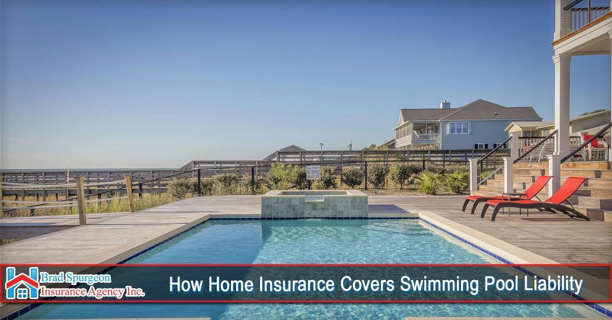 A backyard swimming pool with lounge chairs