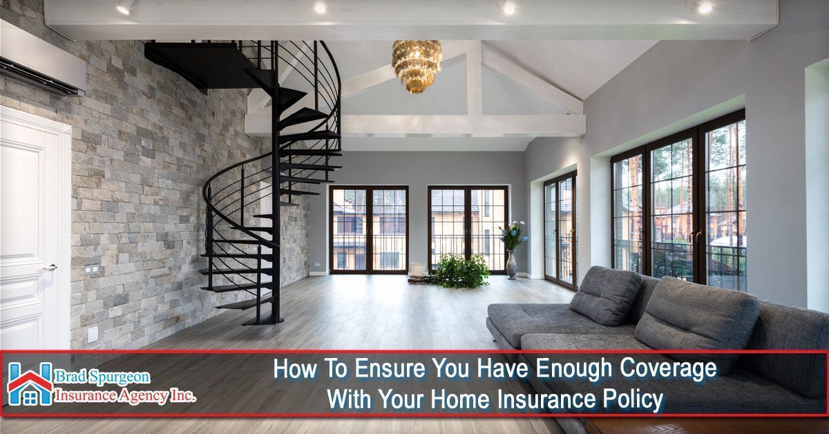 A modern living room with a stone wall and spiral staircase