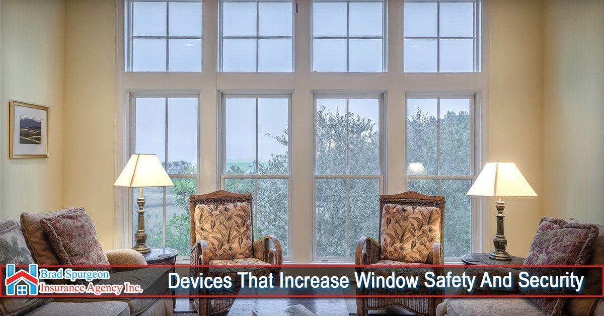 A bright room with four chairs, two lamps, and a large grid window